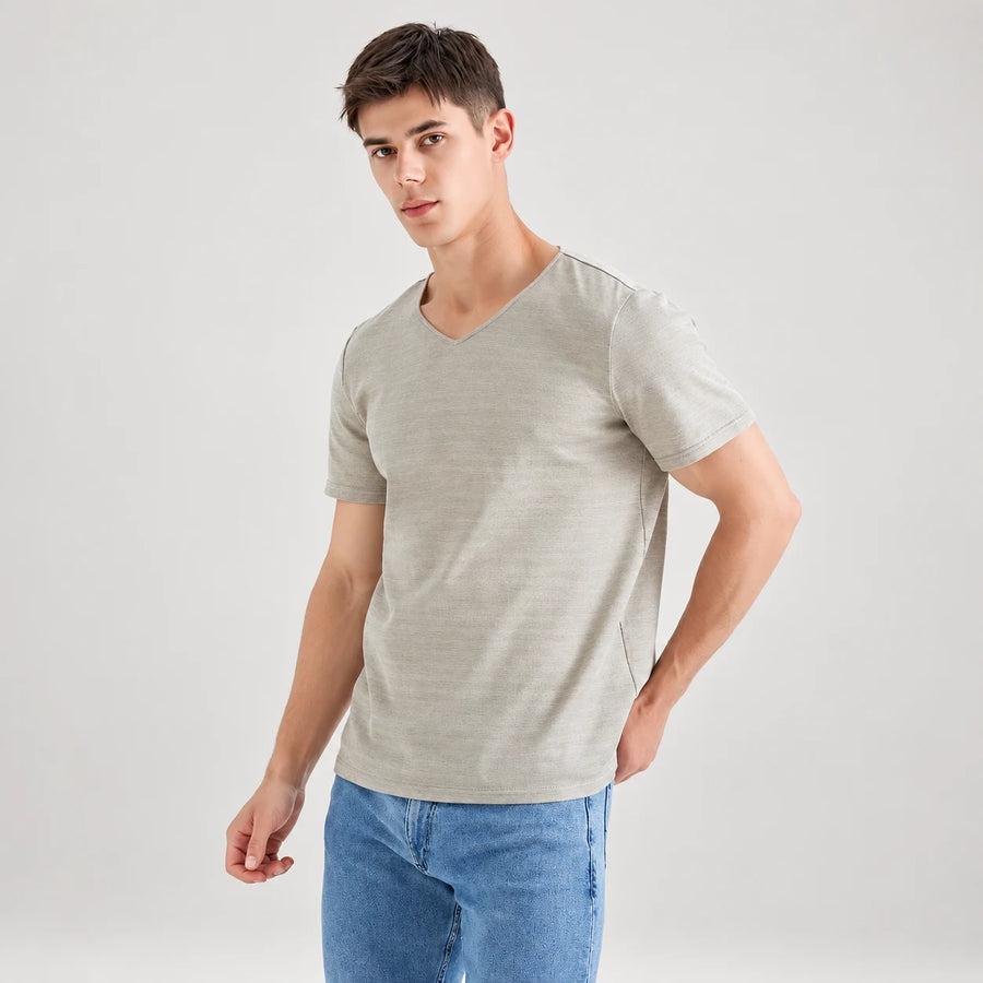 Silver-grey AJ512 V-neck T-shirt worn with blue jeans, shown from the front at a slight angle.
